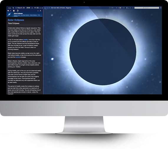 Apple iMac running Starry Night Middle School software showing a planet Saturn simulation